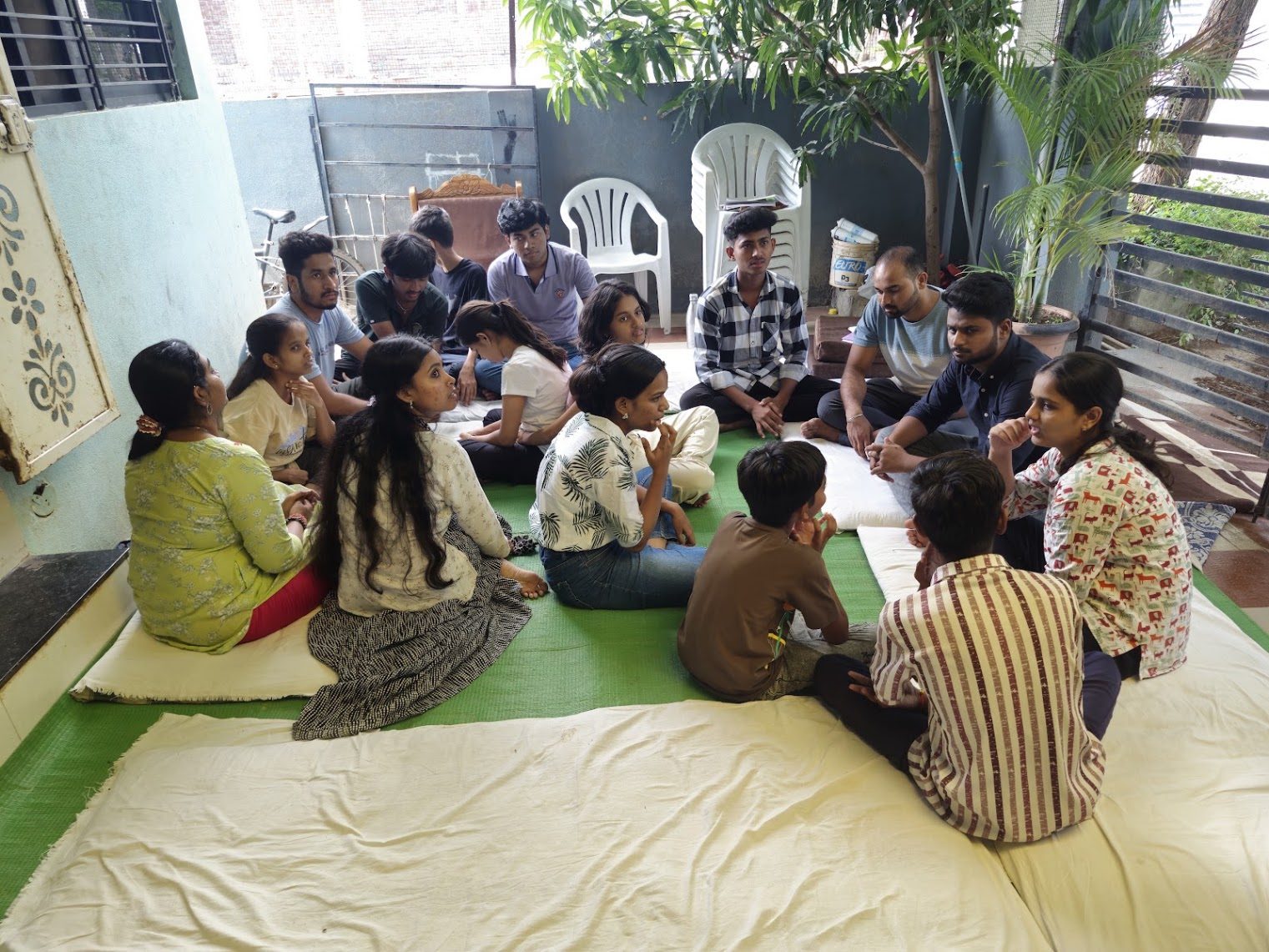 A mentorship circle on a mat
