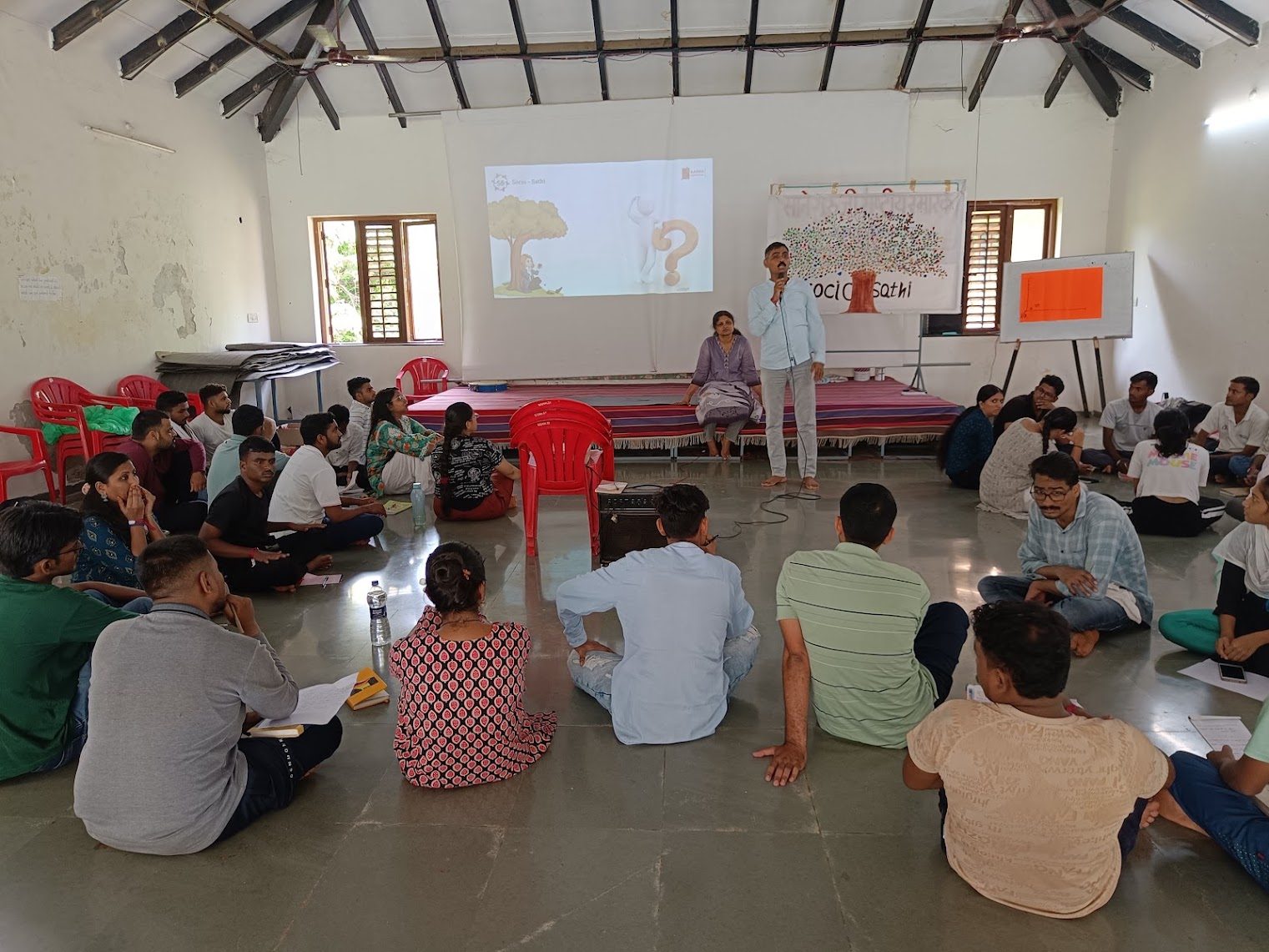 A youth workshop circle at a camp
